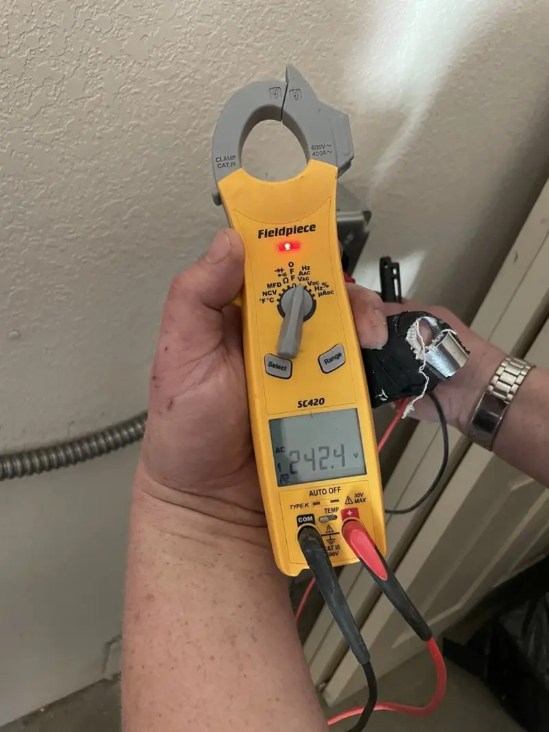 Voltage testing with clamp meter during Outlet Installation in Crownpoint